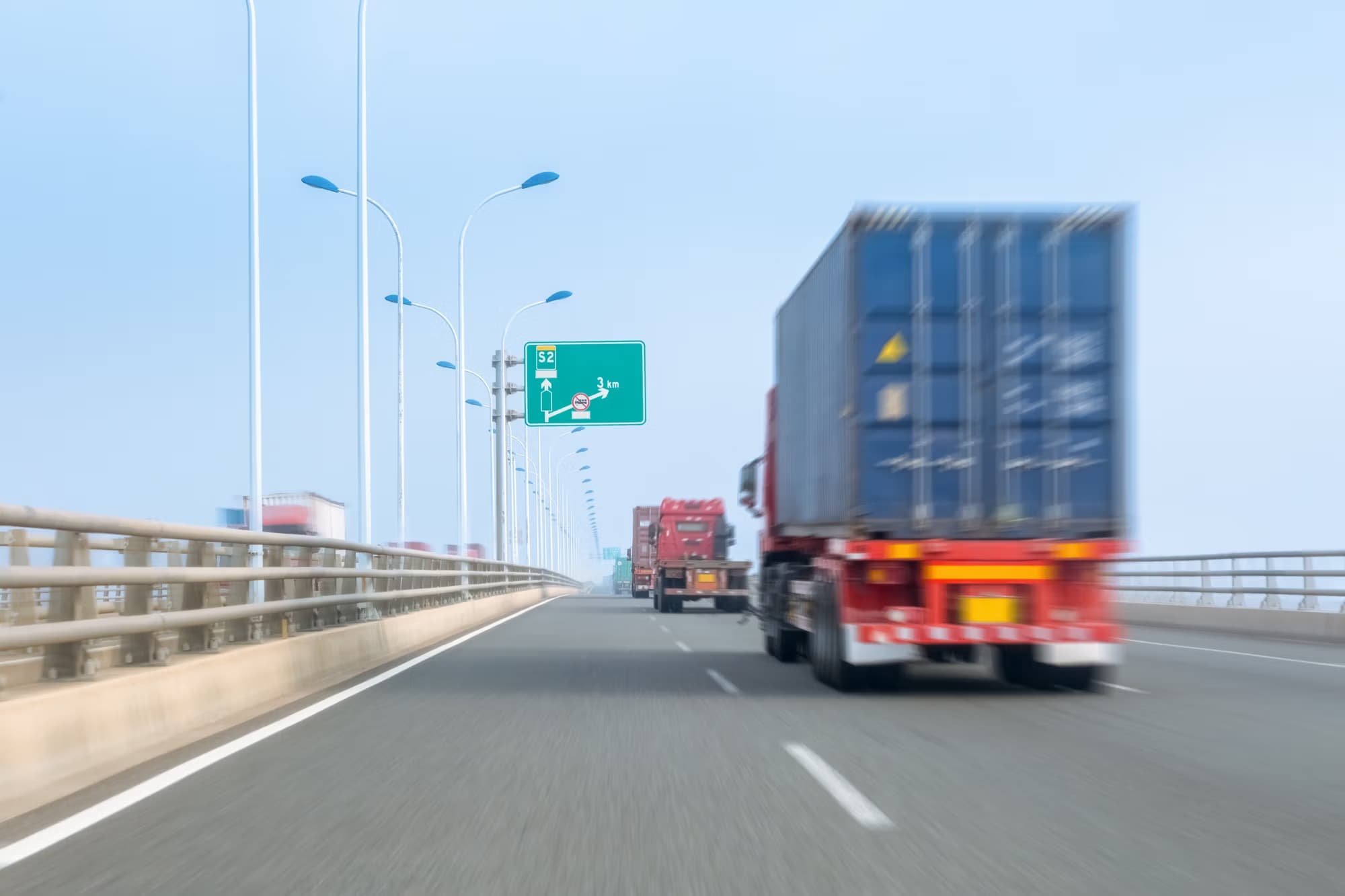 Container trucks on bay bridge